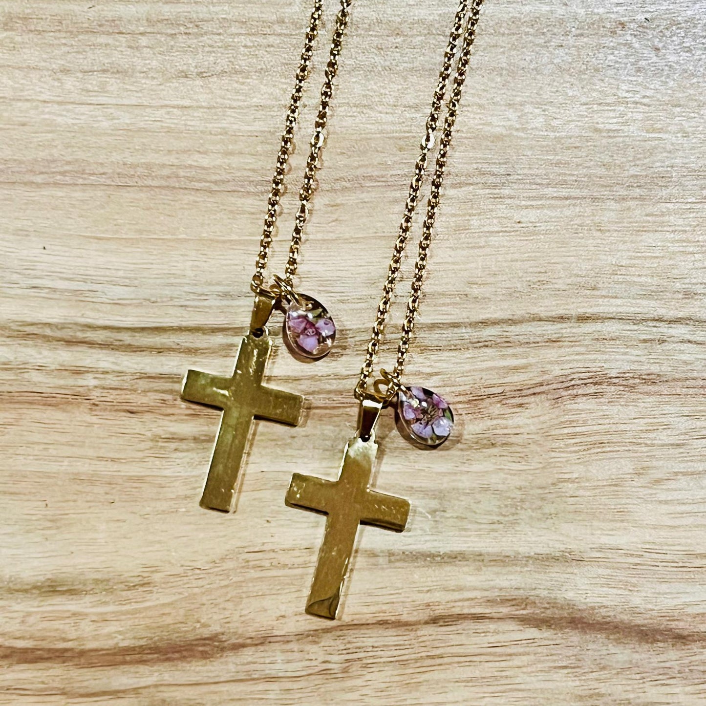 Gold cross with resin-drop